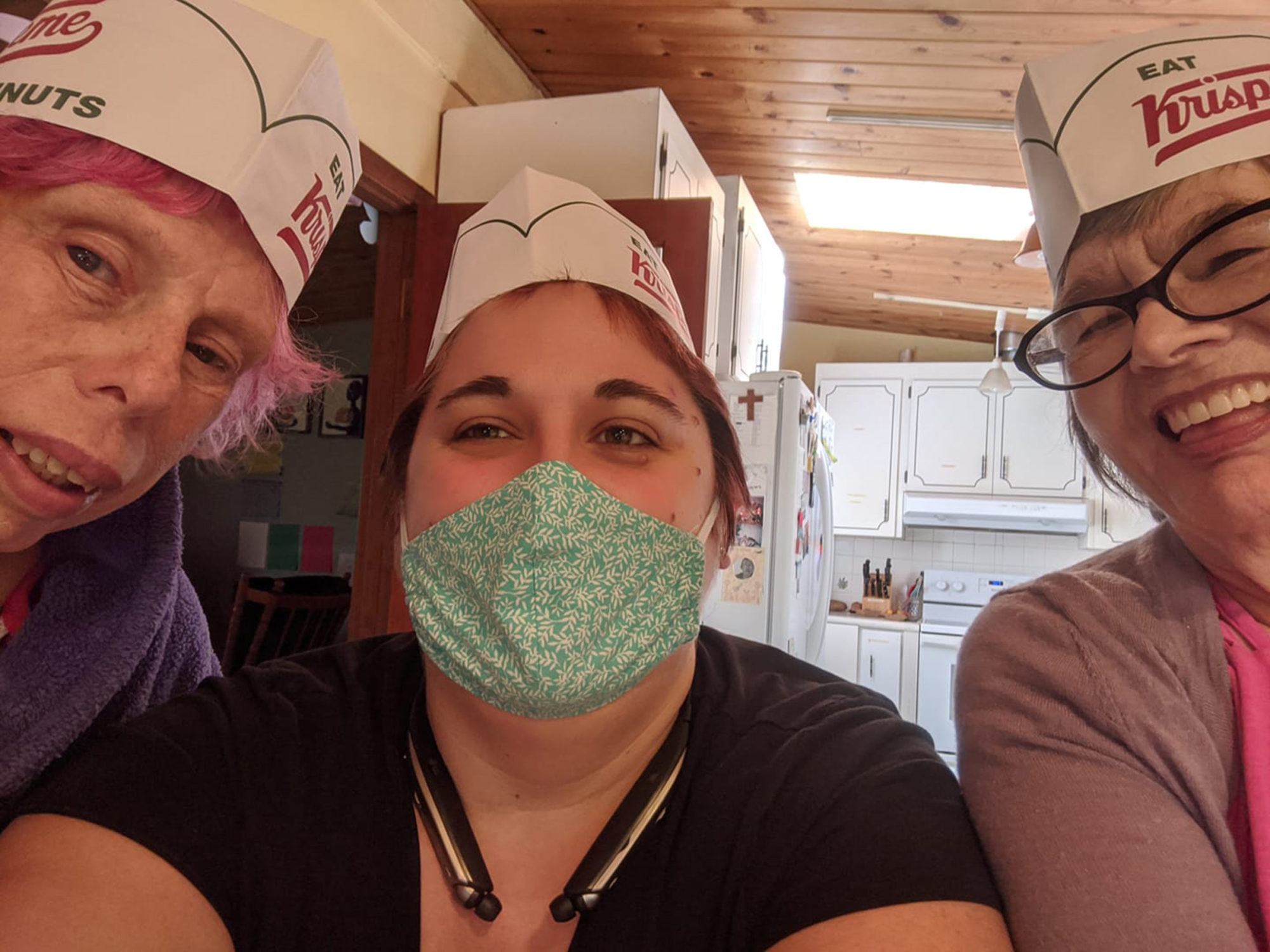 Debbie, Emily and Sharilynn with Krispy Kreme hats on