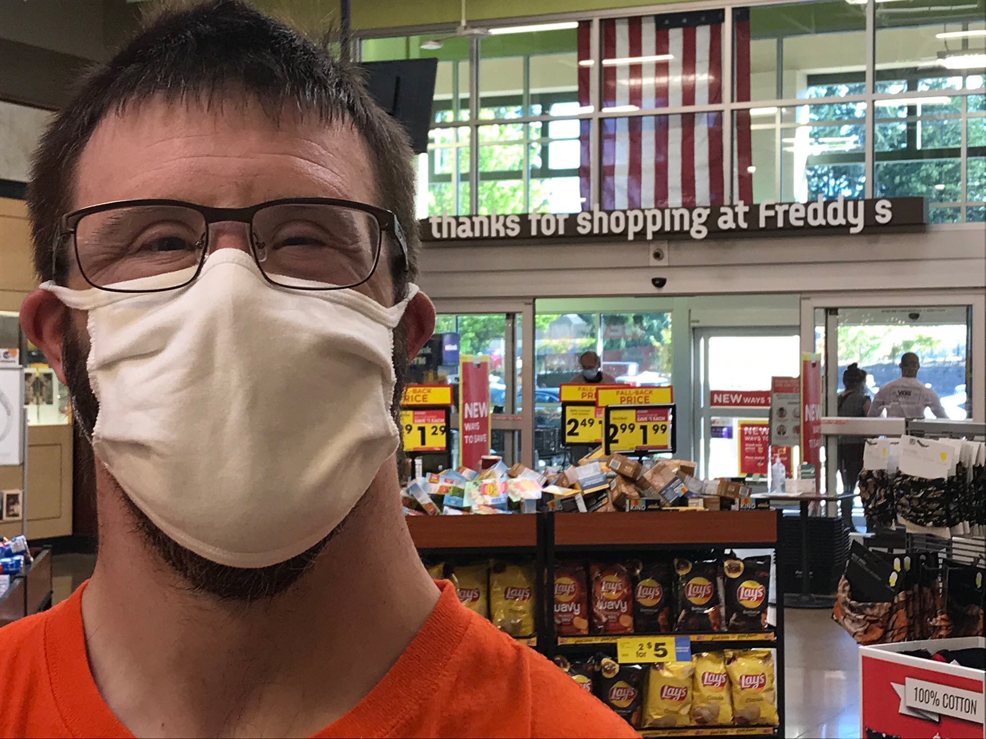 Drew at Fred Meyer, checking off the grocery store item from the list.