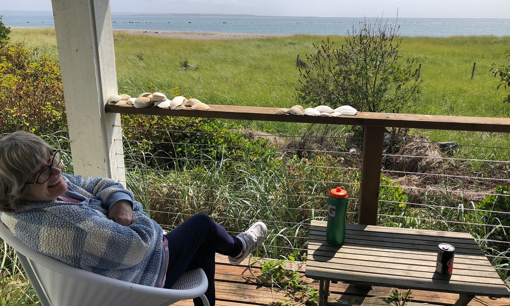 Sharilynn watching the beach from the porch